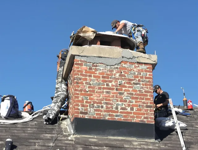 Port Charlotte Chimney Sweep installing a custom chimney crown in Port Charlotte, FL
