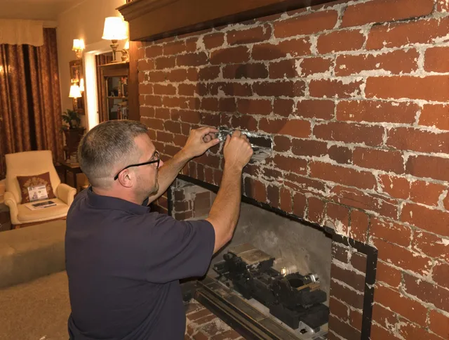 Port Charlotte Chimney Sweep expert fixing a fireplace in Port Charlotte, FL